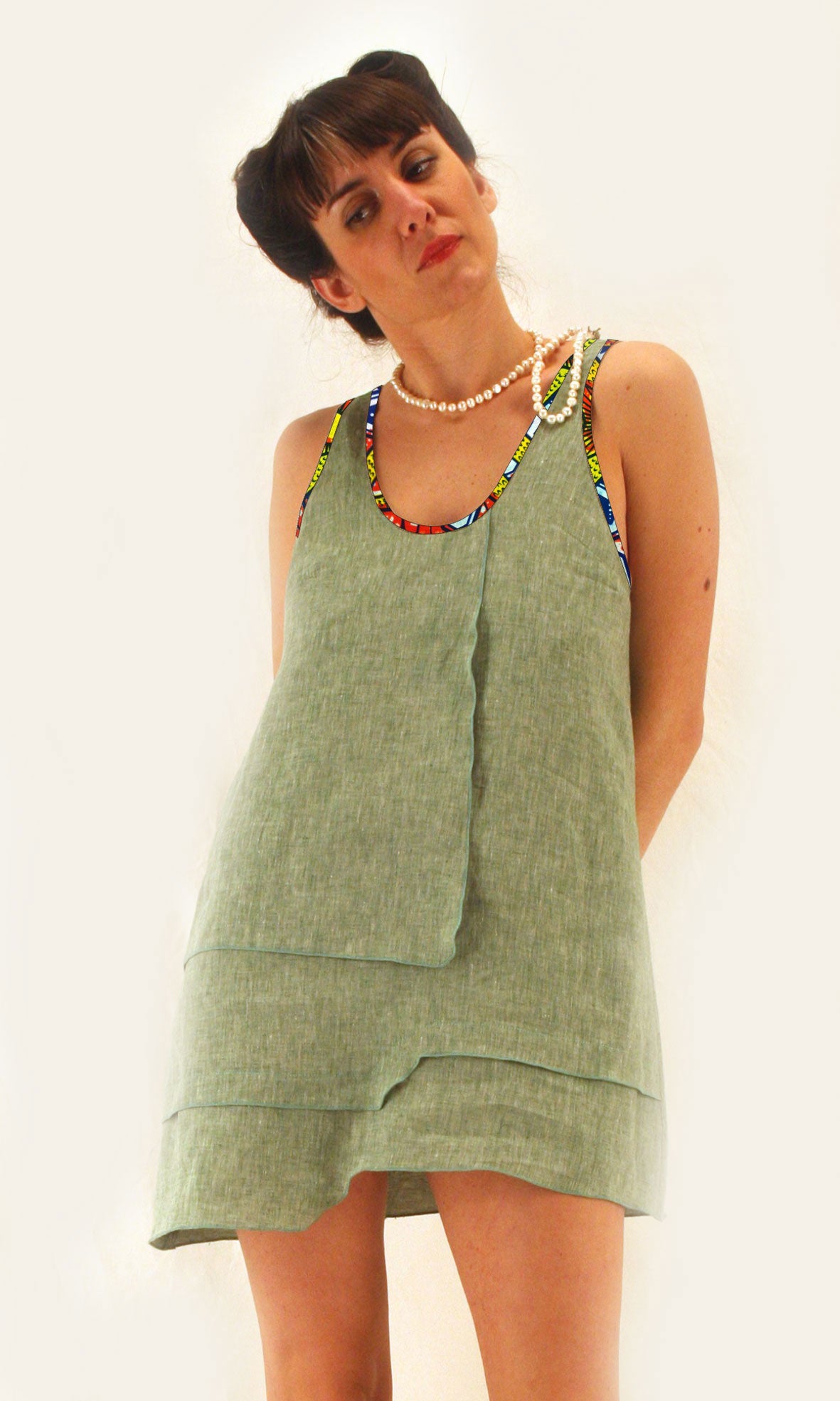 Linen dress with afro profiles with deep neckline at the back and asymmetric hem